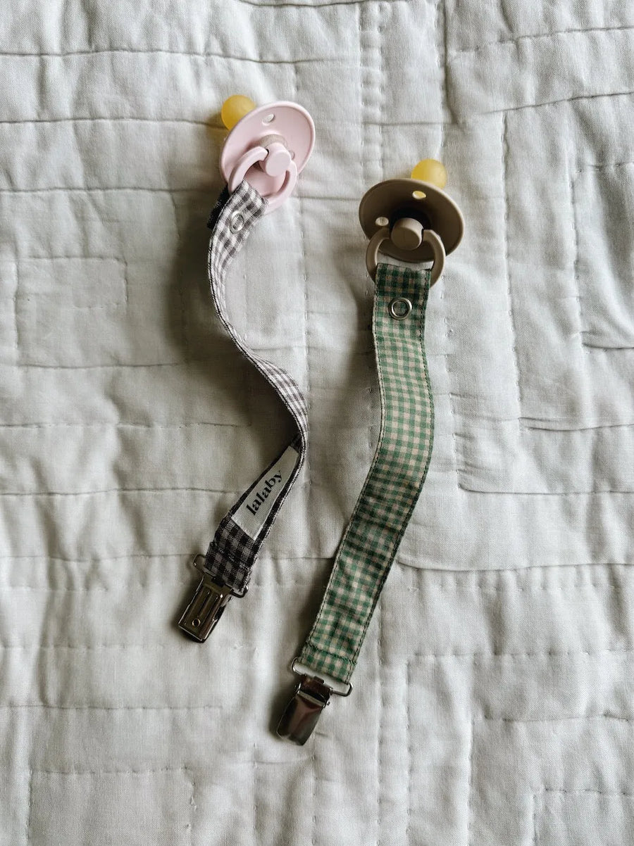 Pacifier clip green check