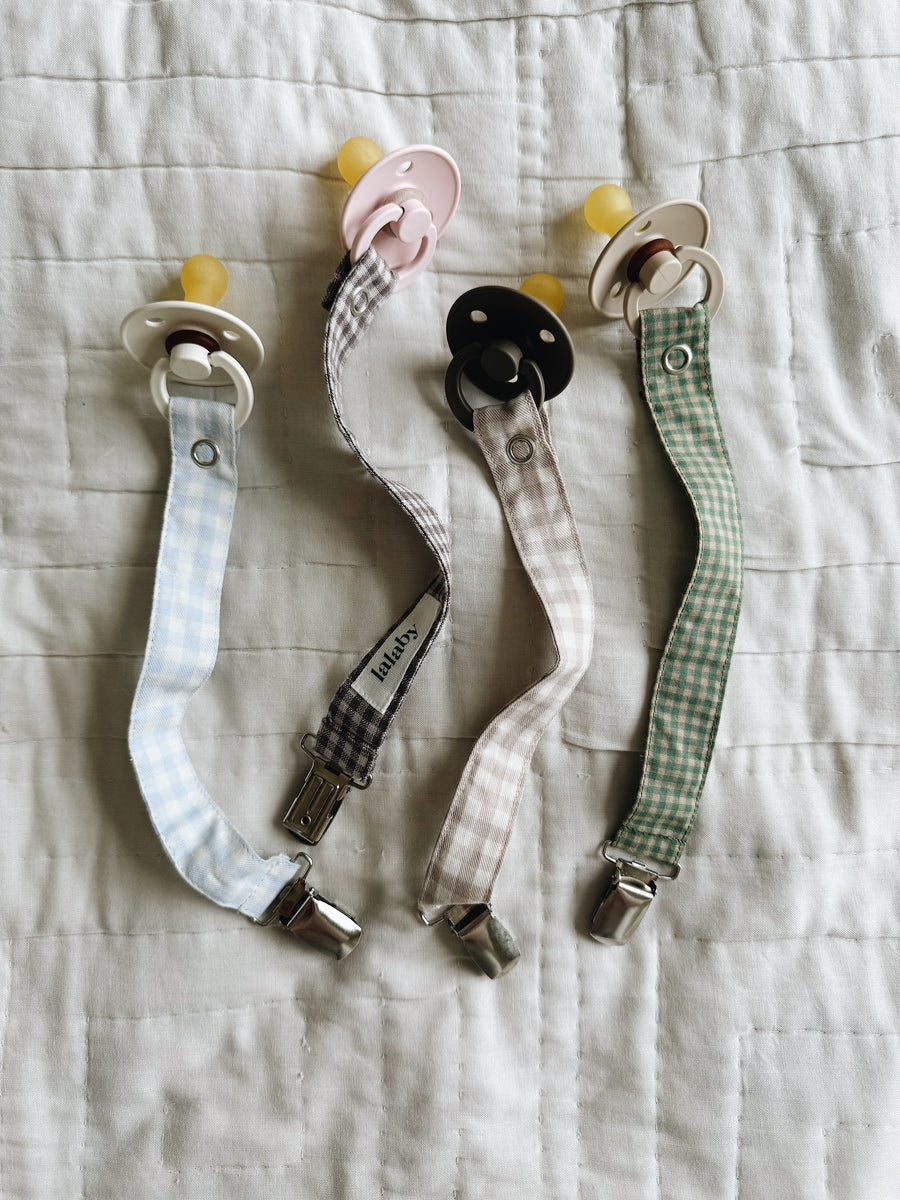 Pacifier clip green check